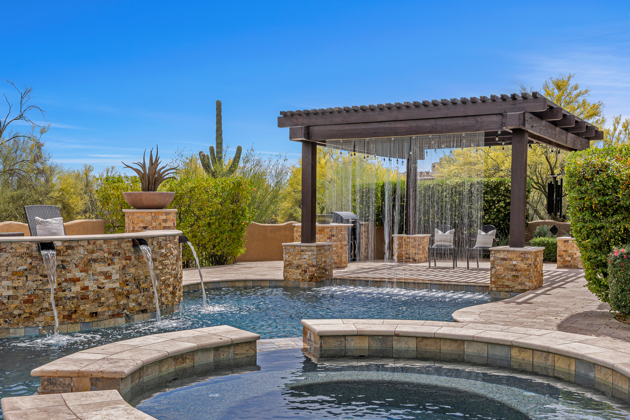 Backyard pool and spa at an Arizona home — the kind of outdoor space Californians find more affordable after relocating